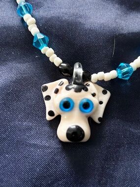 NECKLACE HANDBLOWN GLASS DOG FACE WHITE/BLUE/BLACK WITH BLUE PLASTIC BEADS &